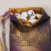 Purple poly-satin Glastonbury Tor pouch with gold poly-satin lining, rune stones that spell Imogen are sitting in the pouch