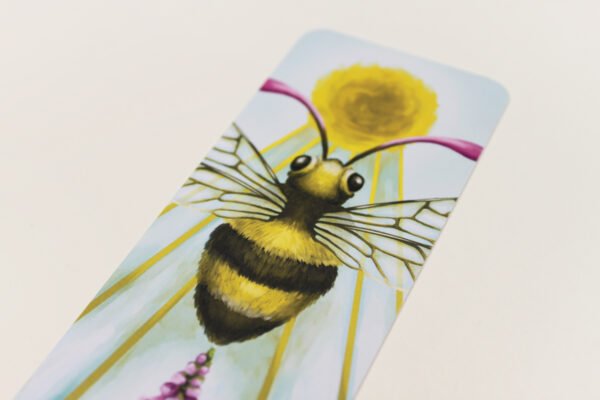 Detail of Sacro Nectare Bookmark showing Honey Bee with magenta antennae and with Sun Disc and Sun Beams