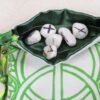 White Cotton Chalice Well pouch with dark green poly-satin lining, rune stones that spell Imogen are sitting in the pouch