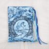 Standing turquoise poly-satin pouch with hand printed Moon Gate pattern, printed using hand carved lino stamp by Imogen Smid
