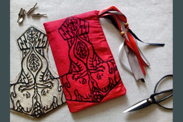 Hand printed pouch with, lino cutters, forged scissors and hand carved lino stamp which was used for printing this pouch