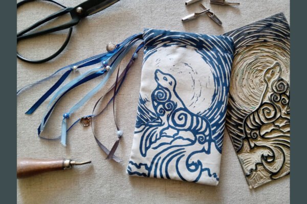 Hand printed pouch with, lino cutters, forged scissors and hand carved lino stamp which was used for printing this pouch